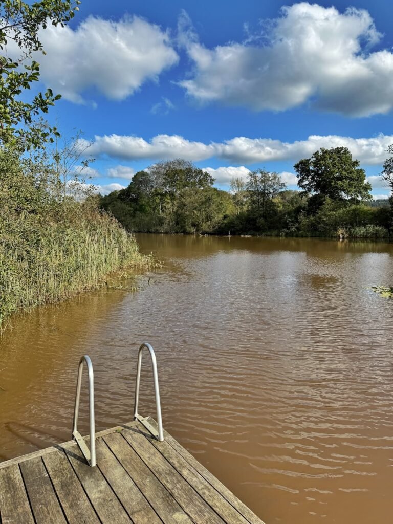 Cold water swimming in the lake at 42 Acres