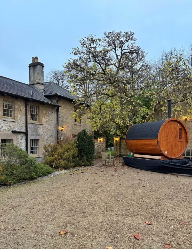 Orchardleigh House estate courtyard with gypsy caravan sauna